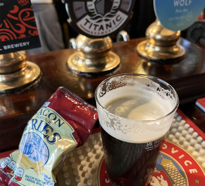 Pint of Dark beer with chips