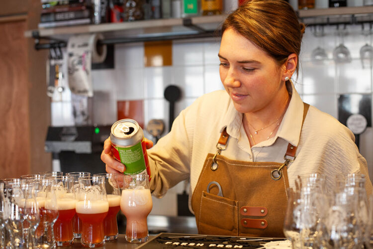 Bartender pouring craft beers