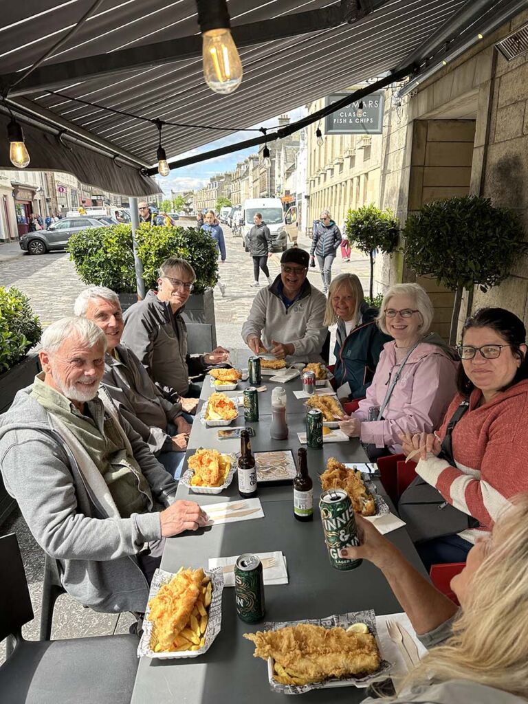 beer trippers enjoying cromars fish and chips